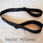 Black belt on a light fabric background with 'Patent Pending' text.